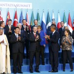 Members of G20 applaud after traditional family photo during the G20 leaders summit in Antalya