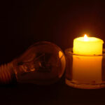 Burning candle and lamp