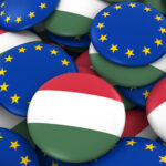 Hungary and Europe Badges Background - Pile of Hungarian and European Flag Buttons 3D Illustration