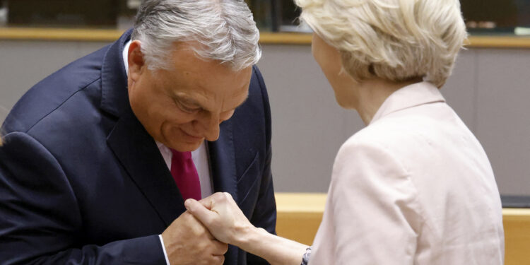 Hungary's Prime Minister Viktor Orban (L) shakes hands with President of the European Commission Ursula von der Leyen prior to the start of a EU leaders Summit at The European Council Building in Brussels on October 26, 2023. EU leaders will debate starting October 26, 2023, in a two day summit in Brussels, for a call for humanitarian "pauses" in Israel's war with Hamas, as the bloc grapples with another conflict on its fringes alongside Russia's invasion of Ukraine. (Photo by Ludovic MARIN / AFP)