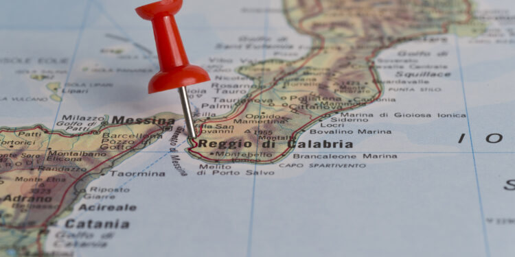 Reggio di Calabria marked with red pushpin on map. Selected focus on Reggio di Calabria and pushpin. Pushpin is in an angle.