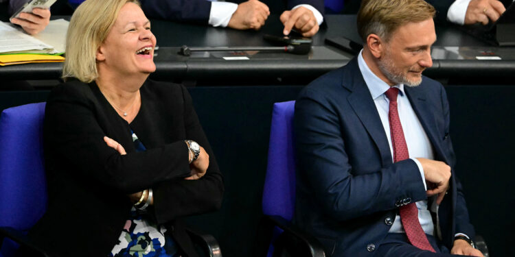 German Finance Minister Christian Lindner (R) and German Interior Minister Nancy Faeser attend a session on the state budget at the Bundestag (lower house of parliament) in Berlin on September 10, 2024. (Photo by Tobias SCHWARZ / AFP)