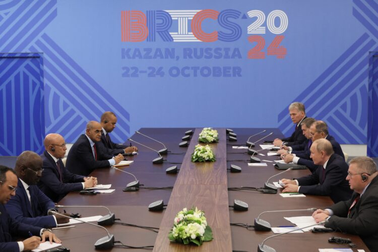 Russian President Vladimir Putin (2nd R) attends a meeting with Mauritania's President Mohamed Ould Ghazouani (3d L) on the sidelines of the BRICS summit in Kazan on October 24, 2024. (Photo by MAXIM SHIPENKOV / POOL / AFP)