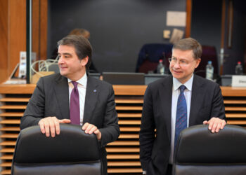 EU Executive Vice-President for Cohesion and Reforms Raffaele Fitto (L) and EU Commissioner for Economy and Productivity, Implementation and Simplification Valdis Dombrovskis (R) arrive to take part in the weekly College of Commissioners at the EU headquarters in Brussels on March 19, 2025. (Photo by Nicolas TUCAT / AFP)