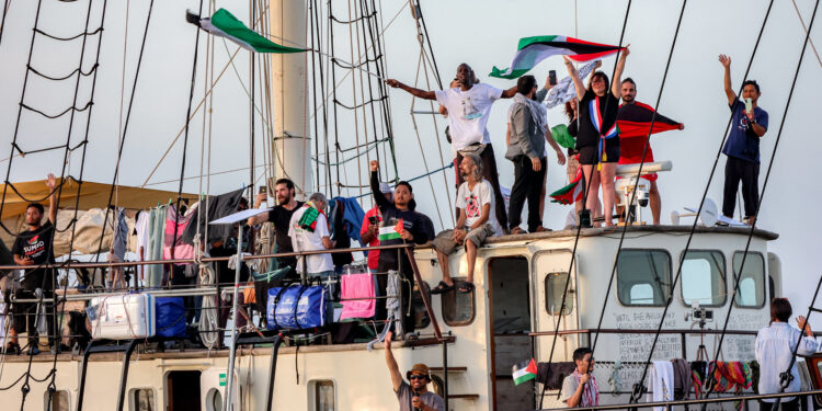 Activists and human rights defenders ride aboard a vessel departing from Tunisia's northern port of Bizerte on September 14, 2025 to join the last boats taking part in the Global Sumud Flotilla, bound for the Gaza Strip to break Israel's blockade on the Palestinian territory. Sumud means "resilience" in Arabic, and the flotilla describes itself as an independent group not linked to any government or political party. (Photo by Mohamed FLISS / AFP)