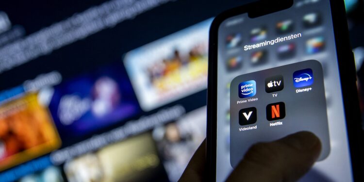 2022-01-19 12:42:46 ILLUSTRATIVE - Applications from streaming services Disney Plus, Amazon Prime Video, Apple TV, Videoland and Netflix on a phone. KOEN VAN WEEL (Photo by Koen van Weel / ANP MAG / ANP via AFP)