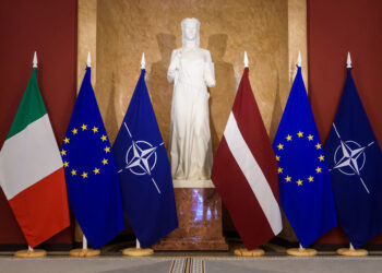 Italian, EU, NATO and Latvian flags are lined up ahead of the mmeeting of the Italian and Latvian Prime Ministers in Riga on July 10, 2023. (Photo by Gints Ivuskans / AFP)