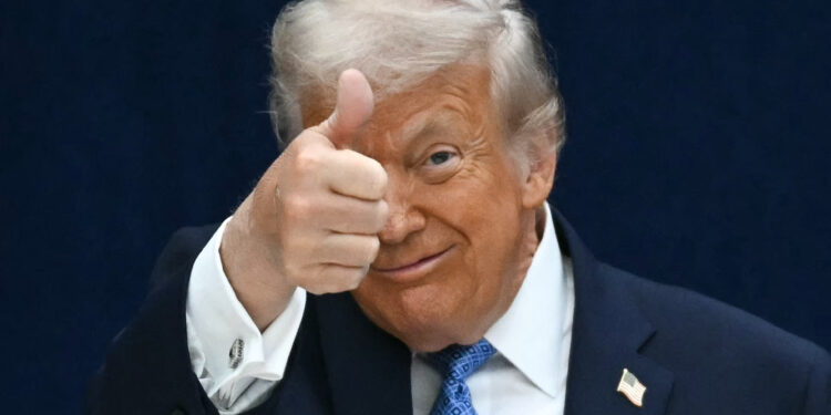 US President Donald Trump gives a thumbs up as he departs the stage during the signing ceremony of a peace deal with the President of Rwanda Paul Kagame and the President of the Democratic Republic of the Congo Felix Tshisekedi at the United States Institute of Peace in Washington, DC, on December 4, 2025. Trump on Thursday brings the leaders of Rwanda and the Democratic Republic of Congo together to endorse a deal that Trump has hailed as his latest peace triumph despite ongoing violence on the ground. Trump hopes the agreement will pave the way for the United States to gain access to critical minerals in the eastern DRC, a violence-torn region home to many of the key ingredients in modern technologies such as electric cars. (Photo by ANDREW CABALLERO-REYNOLDS / AFP)