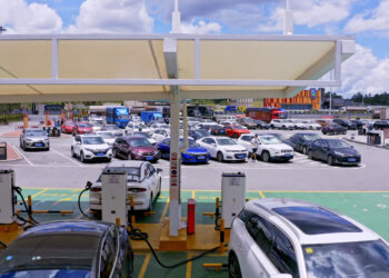 Aerial photography Of Electric vehicle charging station In China Highway Service Area,China,Asia [Credits: Getty Images]
