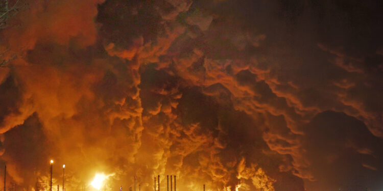 Plumes of thick black smoke rise from oil depot tanks after overnight air strikes reportedly carried out by Israel with U.S. support, northwest of Tehran, Iran, Sunday, March 8, 2026. The attacks hit several fuel storage facilities and petroleum distribution sites in and around the capital, triggering large fires visible across the city and disrupting parts of the fuel supply network. Iranian officials reported multiple facilities damaged and at least four workers killed as emergency crews worked to control the fires. //FARNOOD_Sipa.24726/Credit:BERNO/SIPA/2603090827