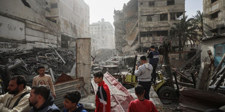 [Photo by Omar Ashtawy/APAImages/Shutterstock (16497571m), via IPA agency].
Palestinians inspect the damaged and largely destroyed building after the Israeli army targeted it in Nasser neighborhood of Gaza City, Gaza on January 31, 2026. At least 29 Palestinians were killed at dawn on Saturday in a series of Israeli airstrikes targeting various areas across the Gaza Strip. Since ceasefire took effect in early October, Israeli actions have killed more than 524 Palestinians.
Palestinians inspect the damaged and largely destroyed building after the Israeli army targeted it in Nasser neighborhood, Gaza city, Gaza Strip, Palestinian Territory - 31 Jan 2026
