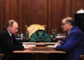 Il presidente russo Vladimir Putin e l'oligarca Aliser Usmano, ex presidente della Federazione internazionale di scherma. Source: Imagoeconomica